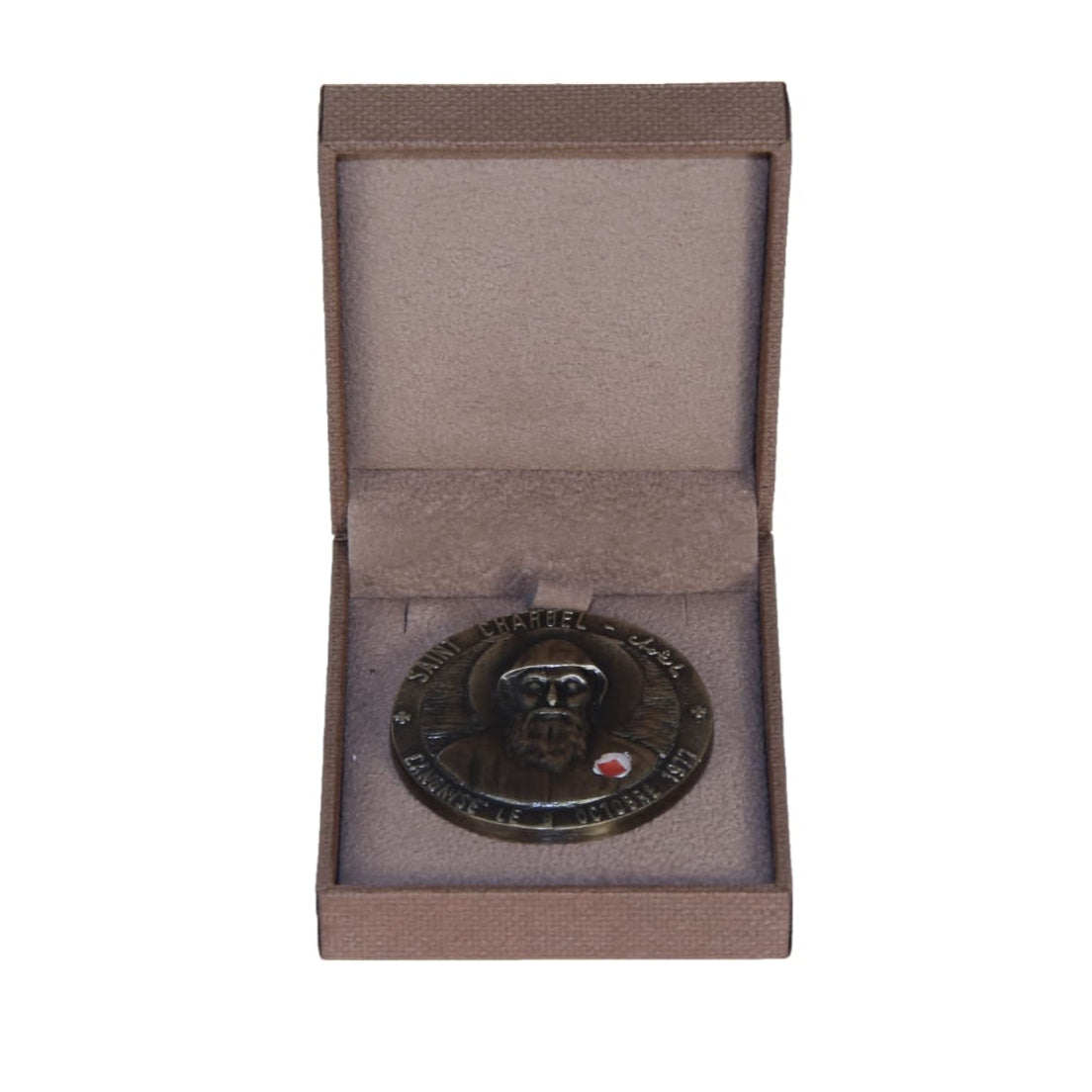 Medal in an open brown box on a white background